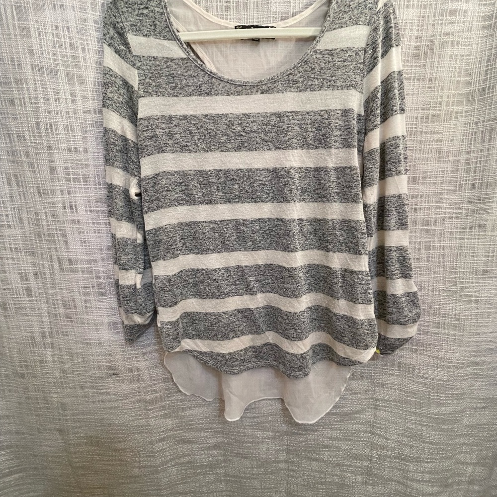 Striped knit shirt with sheer attached tank.  Back reveal sweater